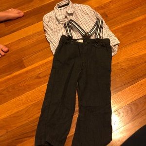 Boys outfit. Plaid shirt and pants with suspenders